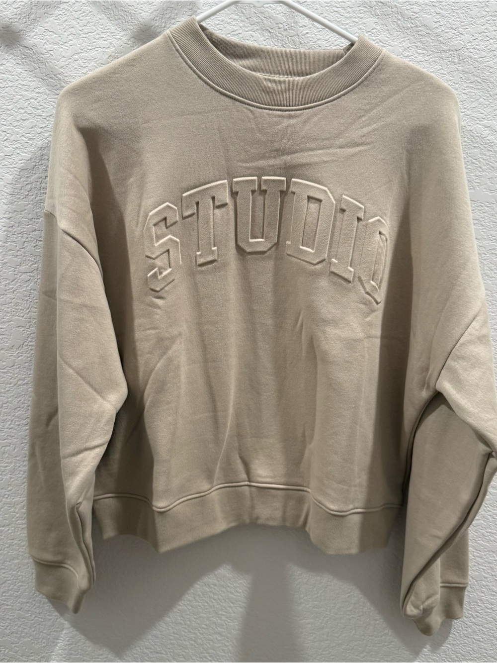 GAP Women's Cream Crewneck Sweatshirt with 'STUDIO' Embossed Logo